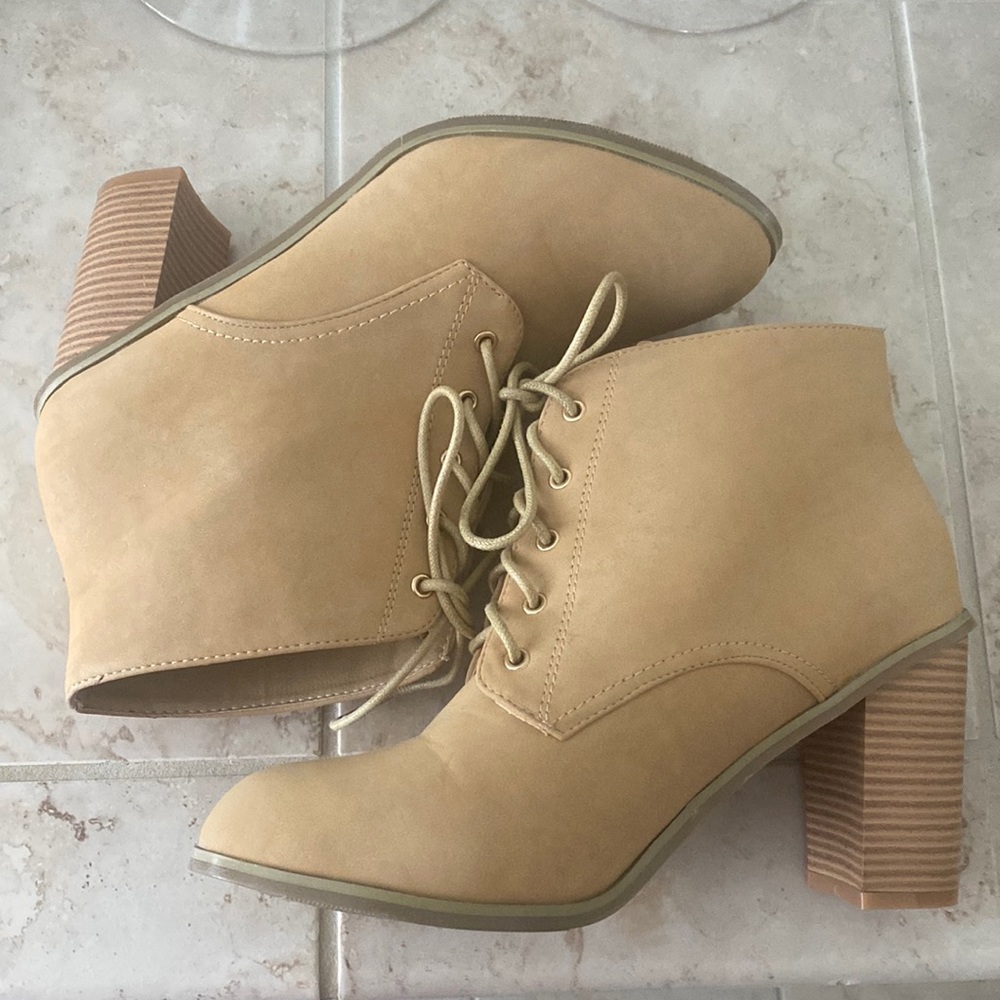 Tan ankle booties with a 6inch heel and laces.